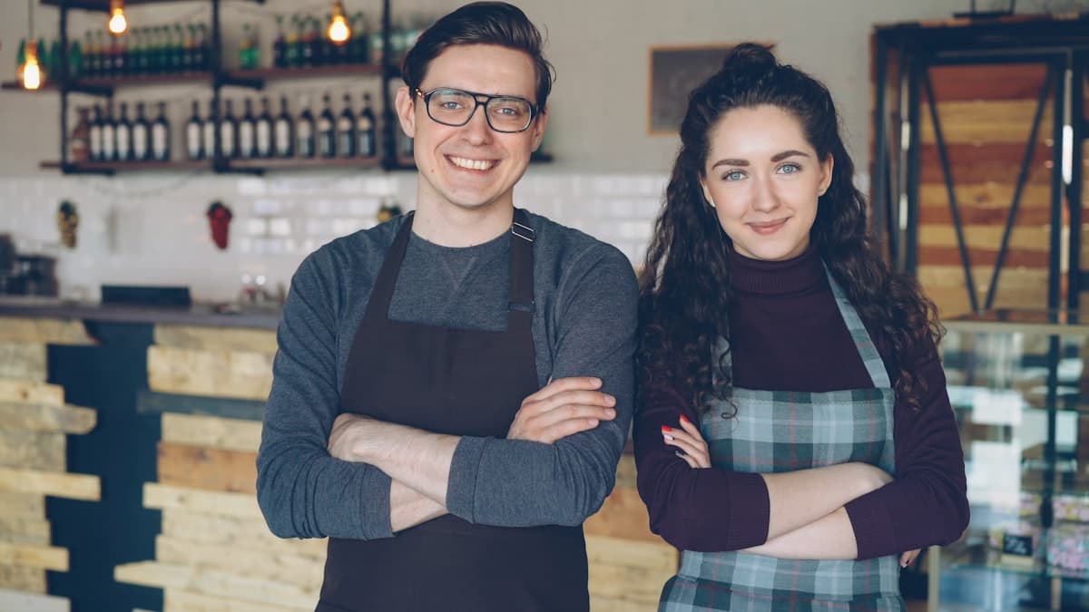 Two small business owners standing together in their shop, representing the many other clients we work with